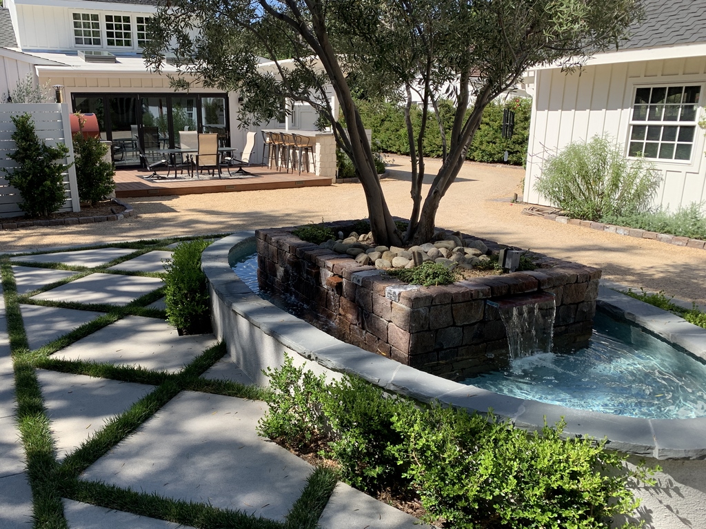 It's tough to develop a landscape design that satisfies the social needs of a family while also meeting the practical needs of a thriving home-based business, writes Colleen Holmes.  Ever consider what's involved in setting up a parking lot so it also serves as an off-hours retreat?