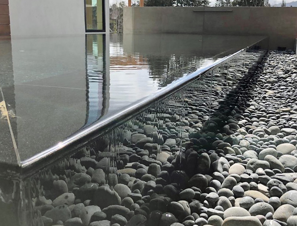 Turning his attention to a reflecting pool after completing two other watershapes on the same property, Steve Swanson suggested using a detail that was new to him.  This bold move involved him directly in the home's overall visual impact and in a high-stakes learning curve.