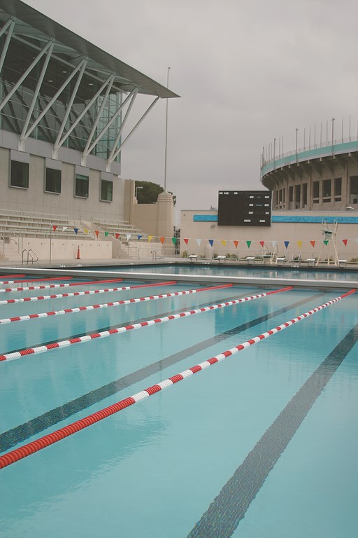 The swimming pools of the 1932 Olympics stand adjacent to the Los Angeles Memorial Coliseum as enduring reminders of the city's history as one of the world's sports capitals.  After decades of use as a competitive venue and community recreation center, however, the facility had fallen into a state of disrepair - a condition from which a consortium of civic groups rescued it with the help of the designers and engineers at Rowley International.