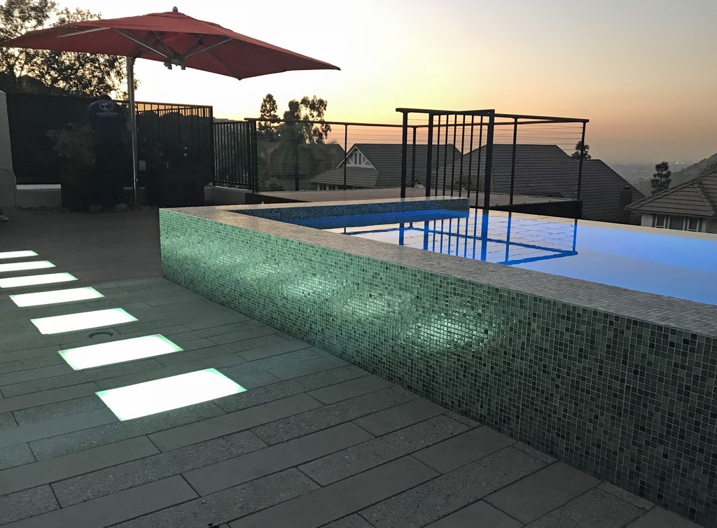 The homeowners had waited decades to revamp their backyard and came to the project with high expectations about how their new spa, fountain and deck would look.  Now it was up to Grant Smith to solve a few tricky technical issues while making the most of the distant views. 