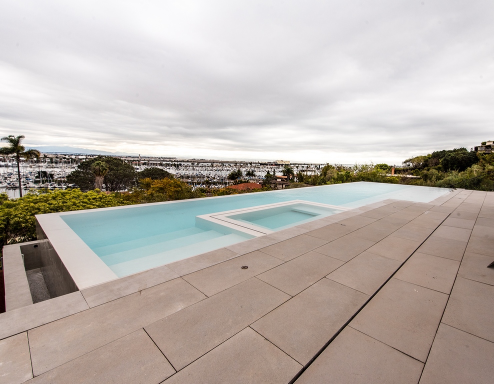 It was a challenging site for a long pool that would overflow on all four sides.  But with the right foundation and a well-engineered shell, writes Grant Smith, the project came together beautifully -- although it apparently wasn't enough to get his clients to stick around to enjoy the view! 