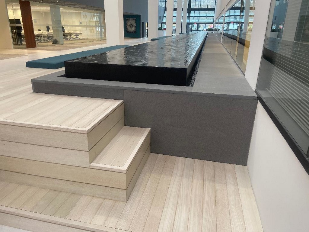 This long, narrow fountain was aimed at transforming a building's huge atrium into a relaxing space for its collection of high-stress tenants.  Executing the job took creativity, writes Robert Nonemaker -- but it also required detailed planning and monumental, step-by-step efficiency.