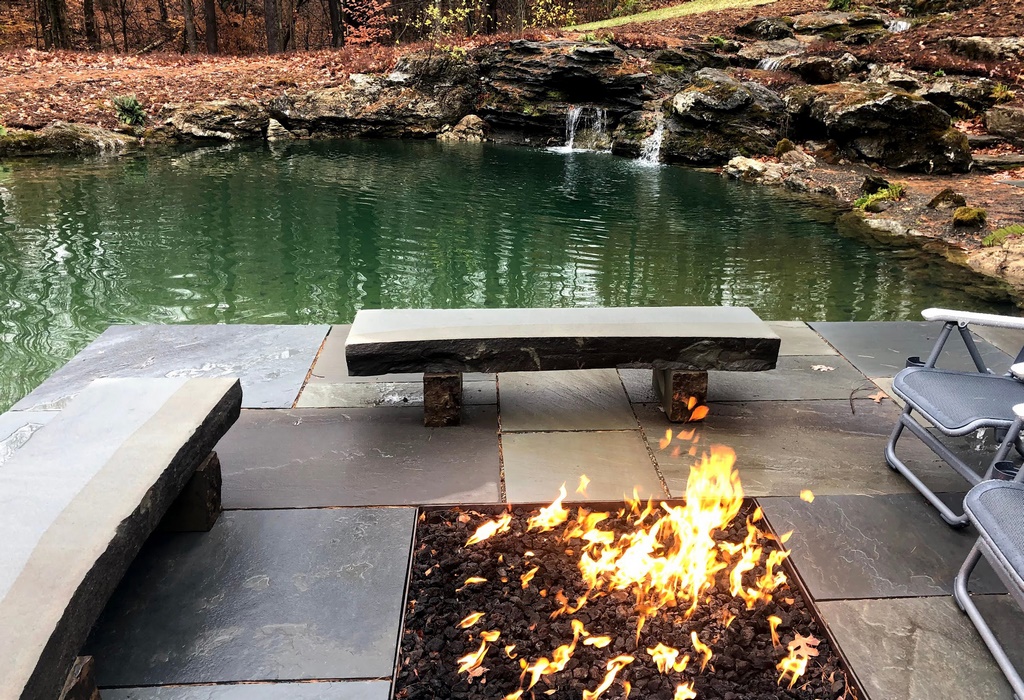Fire adds a contrasting element to the quiescent water, a perfect place for coffee and a book, or a glass of wine and good conversation. 