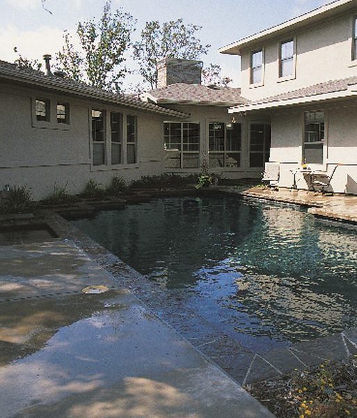 Taking inspiration from Frank Lloyd Wright and features of the client’s home, pool designer and builder Michael Nantz worked a bit of backyard magic. By carefully shaping lines, contours, textures and elevations, he crafted a swimming pool and reflection pond that balance water with wood, hardscape and landscape – and accomplished a high-flying design with a decidedly down-to-earth price tag.