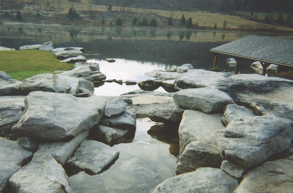 Even for a firm that specializes in massive natural-stone watershapes, this Pennsylvania project was one for the record books. Working for an enthusiastic client who demanded beauty and visual drama on a truly enormous scale, the staff at Glacier Inc. stepped well beyond the usual in renovating a 78-acre private lake while creating a long, cascading stone stream and waterfall – with a grotto thrown in for good measure.