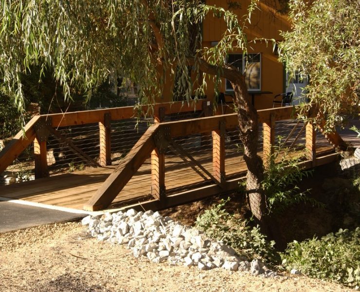 The art and craft of building wooden bridges has been overtaken through the years, with steel and reinforced-concrete structures almost entirely supplanting them for the past 100 years or so. But designer/builder Dan Moosman has bucked the modern trend, providing his clients with Craftsman-style wooden bridges that now grace landscapes across the country and make strong aesthetic statements wherever they’re placed.