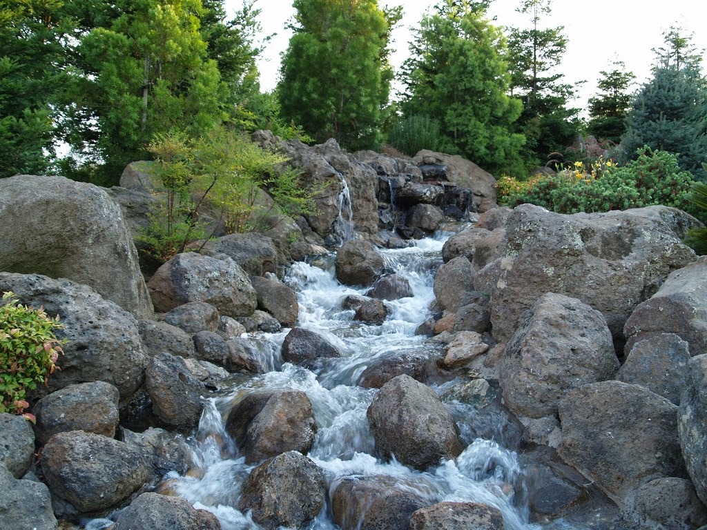 When Bill Goddard decided to change careers and move into watershaping and landscaping as a full-time pursuit, he dove right into the thick of things with a first project of immense scale and extraordinary visual drama. He discusses his bold introduction to the business here, profiling a project that encompasses a pair of huge waterfalls, extensive landscaping and lighting, hundreds of tons of stone and even a miniature town.